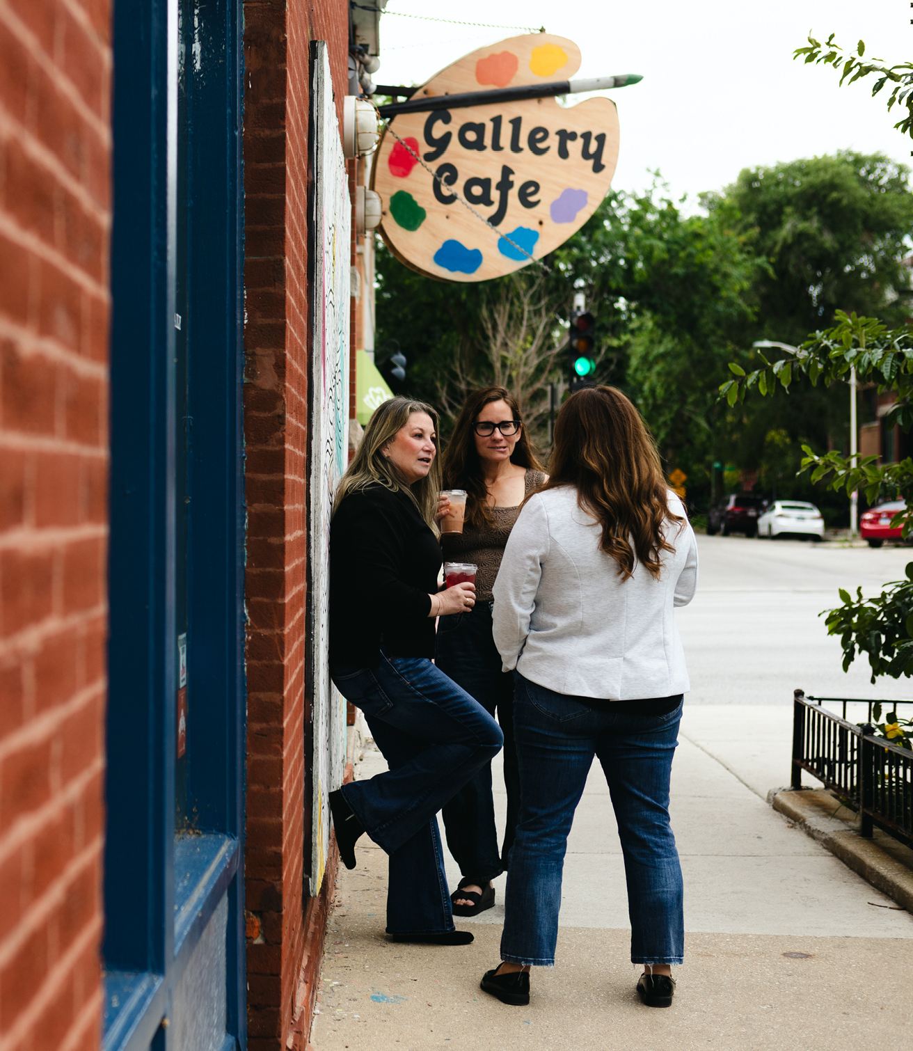 Julie A. Katz talking with colleagues outside Gallery Cafe in Chicago