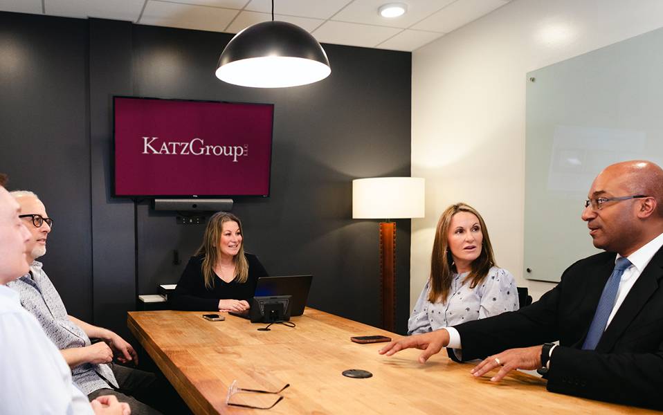 Julie A. Katz leading a client meeting around a conference table at Katz Group