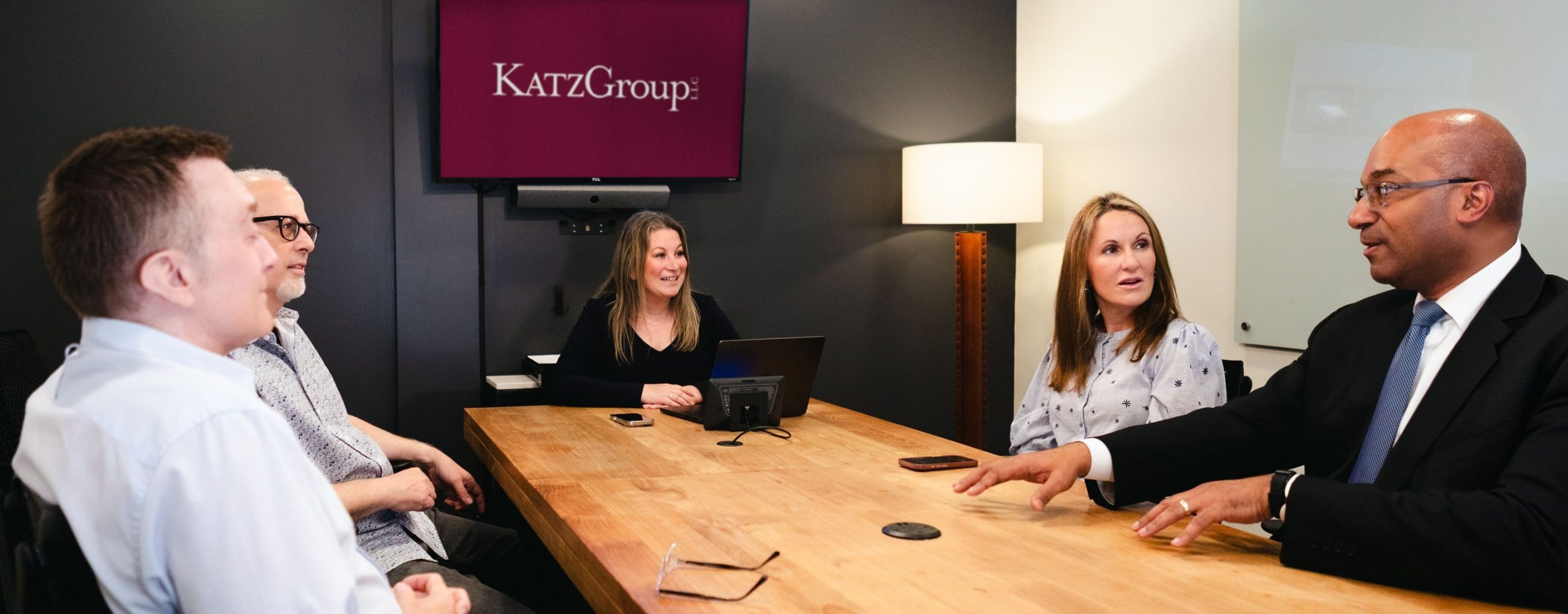 Julie A. Katz leading a client meeting around a conference table at Katz Group