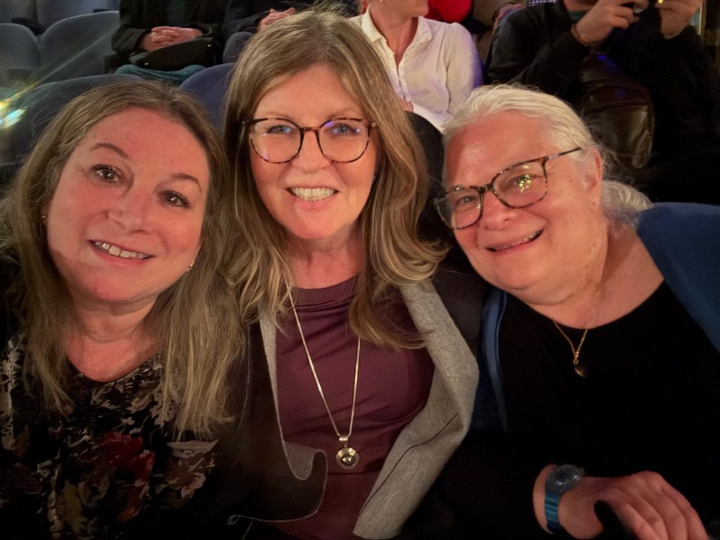 Three colleagues at an evening event in London